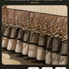 A set of three sheer bed skirts and pillowcases featuring gold embroidery and a warm sleep theme.