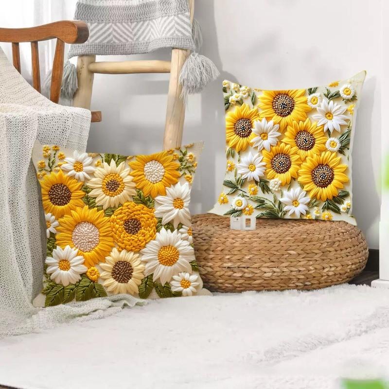 A decorative pillow cover featuring a dense pattern of yellow and white sunflowers on a neutral background.