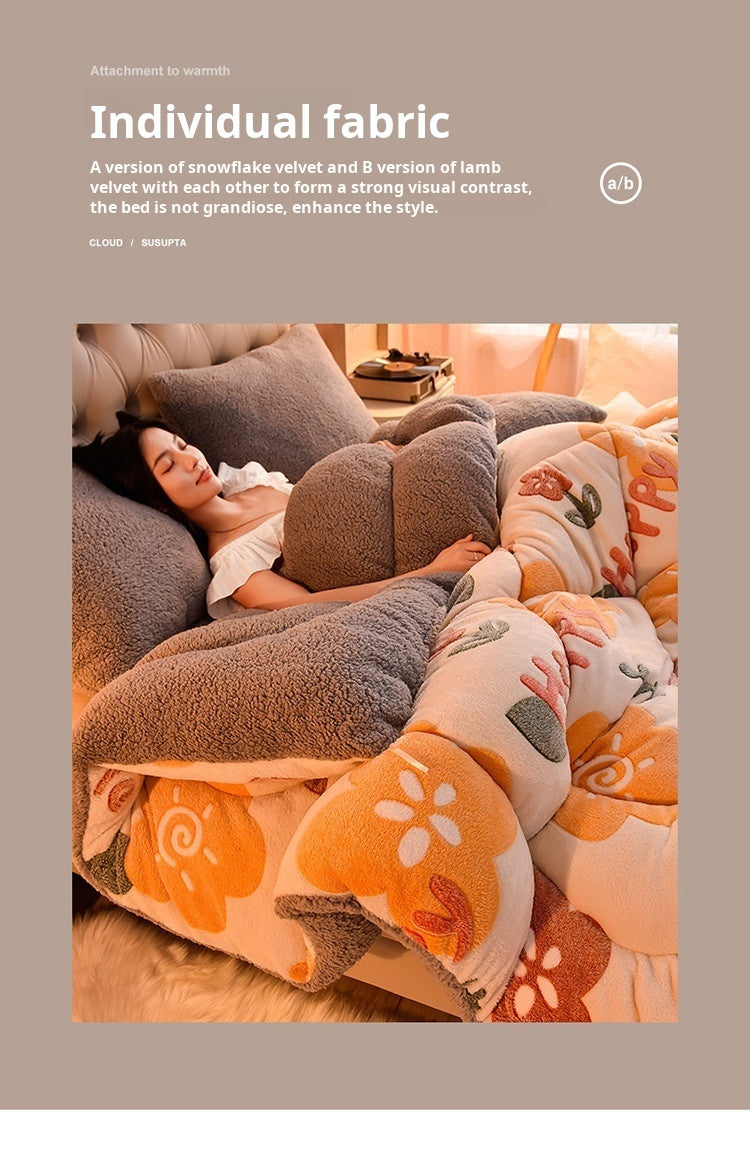 A close-up of a plush fleece blanket featuring individual fabric designs in shades of orange, beige, and brown.