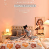A cozy bedroom scene featuring a plush fleece blanket with floral patterns on a bed.