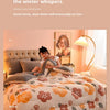A cozy bedroom scene featuring a plush double-sided fleece blanket with floral patterns on a bed.