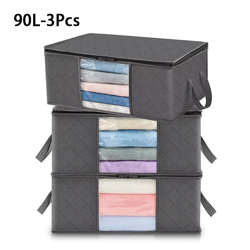 A set of three gray foldable clothes organizer bags with clear windows.