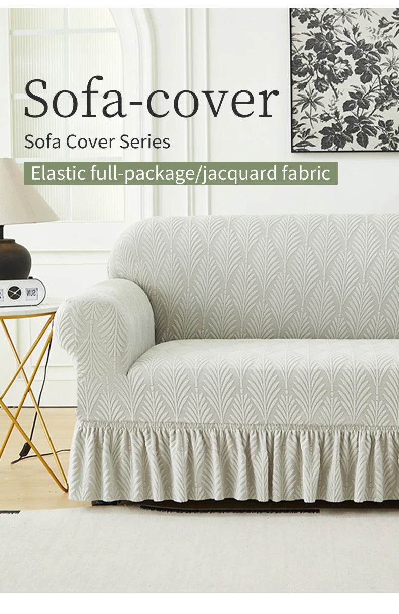 A white jacquard fabric sofa cover featuring a textured pattern and ruffled hem on a sofa.