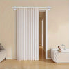 White vertical folding privacy curtain installed on a door frame in a light-colored room.