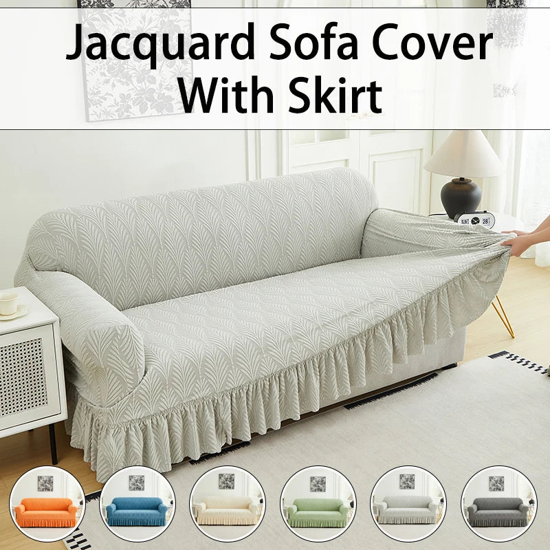 A light gray jacquard sofa cover with a skirt shown on a modern sofa.