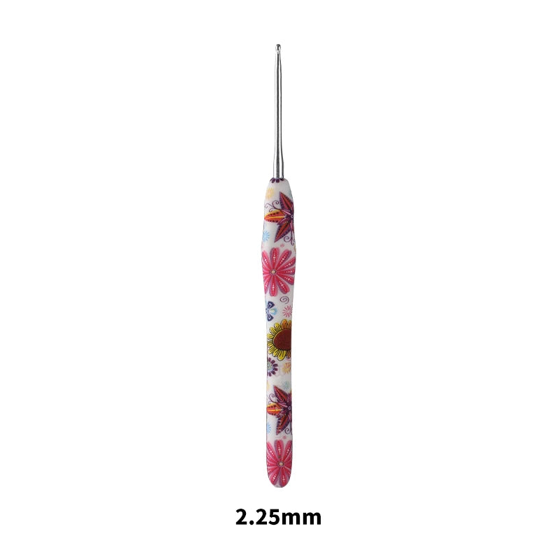 A single handmade crochet knitting hook with a colorful, floral design.