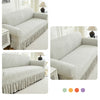 A light gray sofa cover featuring a textured fabric and a ruffled hem, shown in various angles.