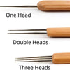A set of wooden crochet hooks showing one, double, and three heads.