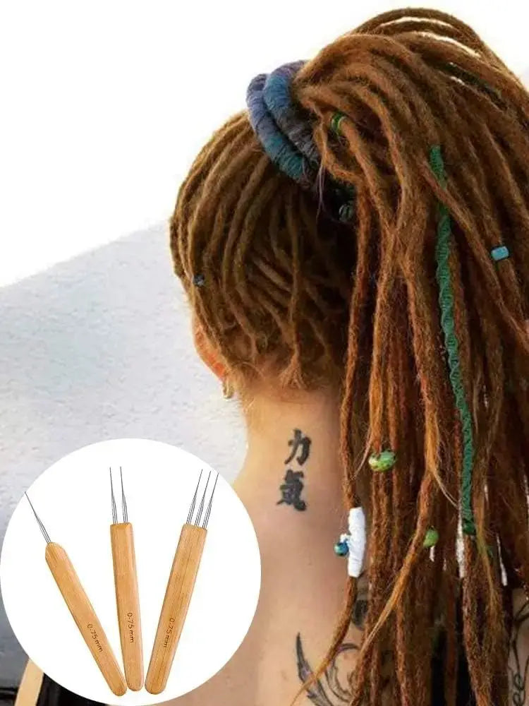 A close-up of a person's hair styled in dreadlocks with colorful threads, showing a set of crochet hooks.