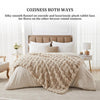 A beige faux fur blanket is draped over a bed, showcasing its silky smooth flannel and plush rabbit faux fur texture.