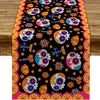 A vibrant Day of the Dead sugar skull linen table runner featuring colorful floral patterns on a black background.