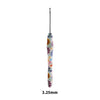 A long, slender crochet knitting hook with a colorful, floral design.