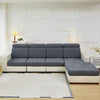 A modern gray sofa with light cream upholstery and a matching white rug in a bright room.