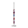 A close-up view of a handmade crochet knitting hook with colorful floral designs.