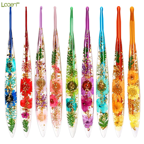 A set of ten floral patterned epoxy crochet hooks in various colors and designs.