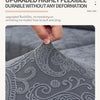 Close-up of a gray jacquard sofa cushion cover fabric showing intricate floral embroidery detail.