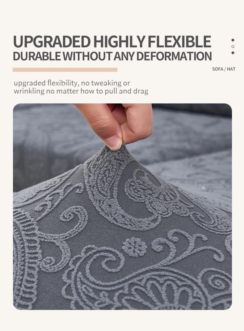 Close-up of a gray jacquard sofa cushion cover fabric showing intricate floral embroidery detail.