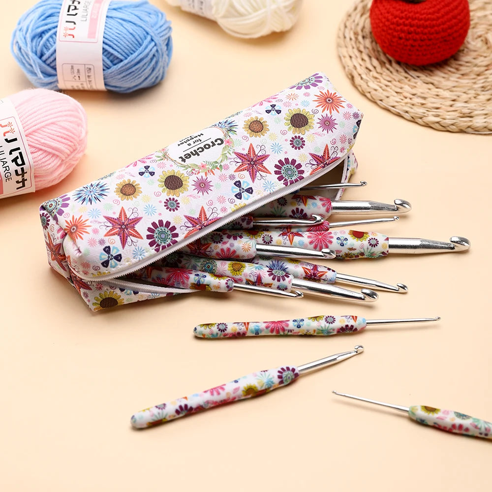A set of colorful crochet knitting hooks in a zippered case and loose, individual hooks are displayed on a beige background.