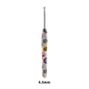 A long, slender crochet knitting hook with a colorful floral design.