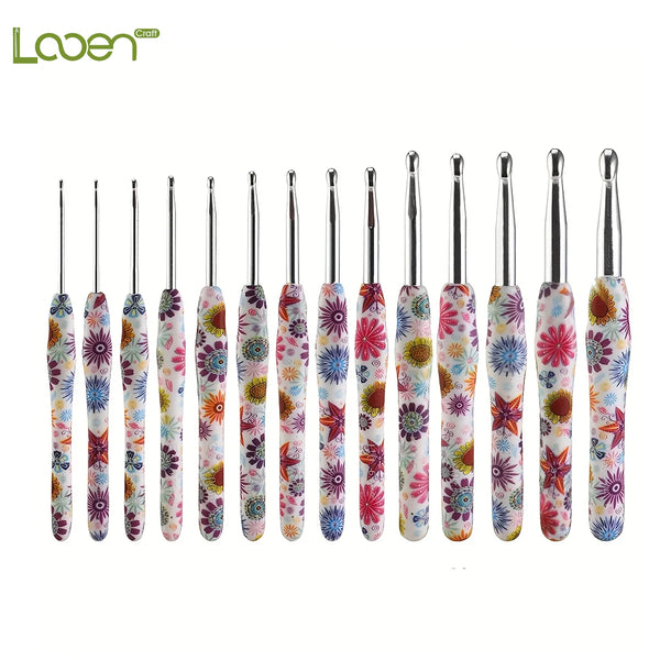 A collection of handmade crochet knitting hooks featuring colorful floral designs in various shades of pink, green, and white