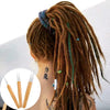 A woman shows off long, reddish-brown dreadlocks styled in a ponytail with blue accents and a crochet hook set.