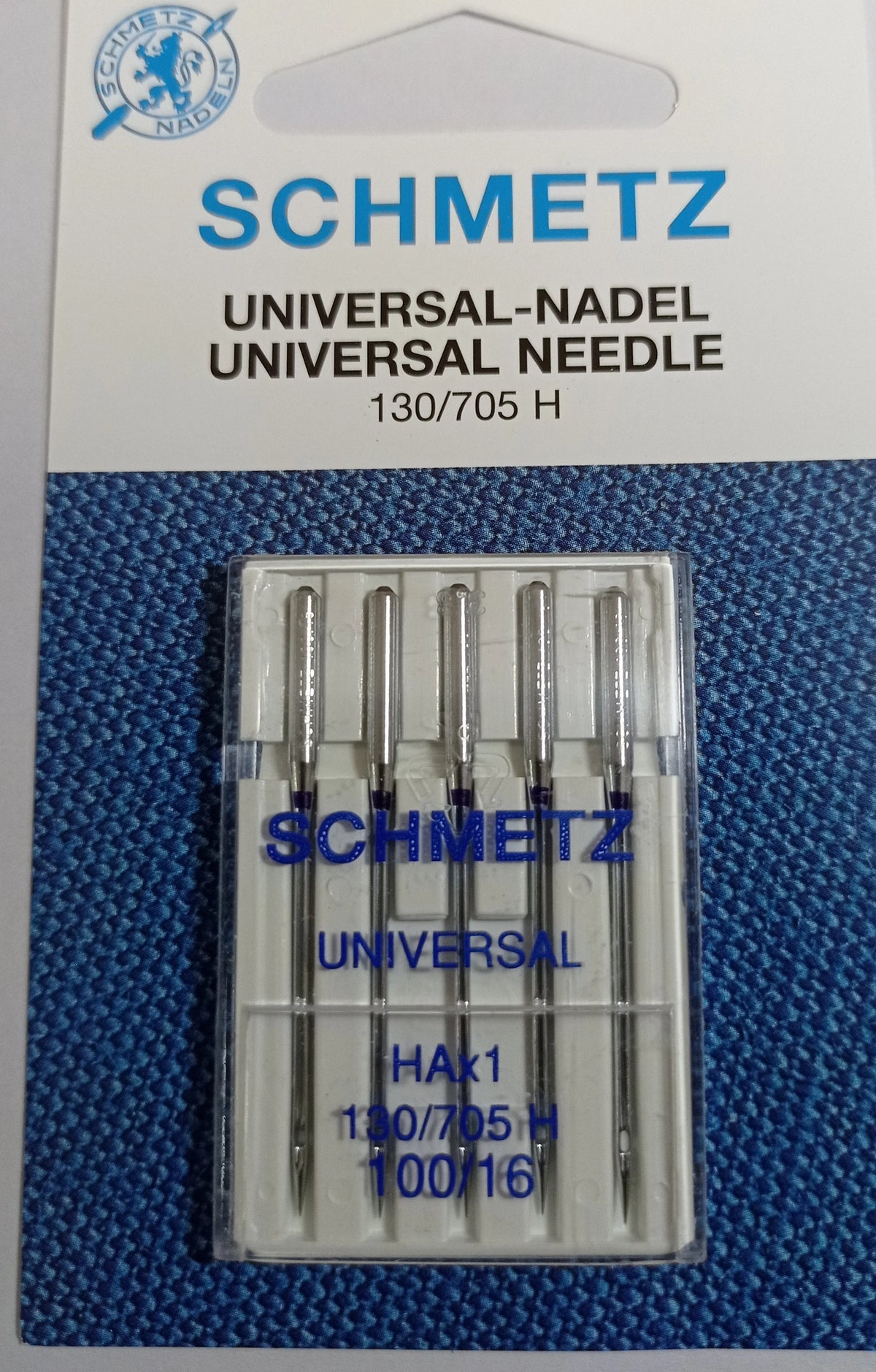 A package of SCHMETZ universal sewing machine needles, model 130/705 H, packaged in a clear plastic case.