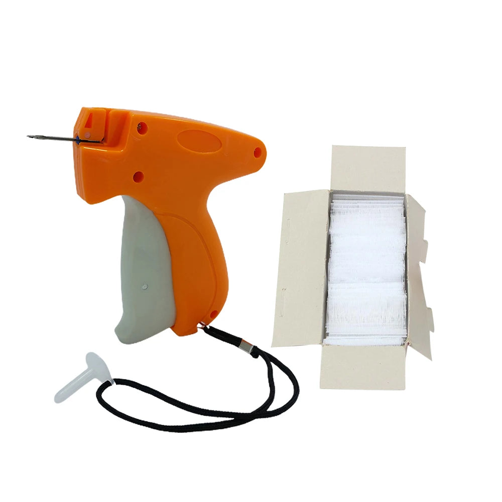 An orange professional clothing price tagging machine with a white label and black cord next to a blank white tag.