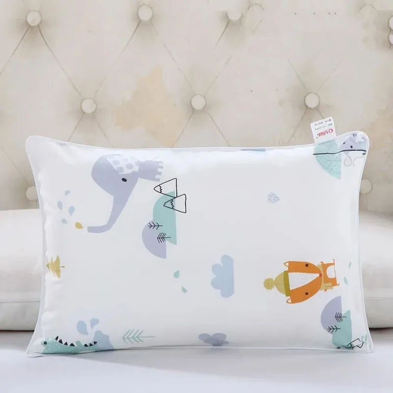 A white cartoon style children's pillowcase featuring light blue elephant and leaf designs.