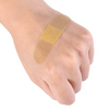 A hand shows a waterproof adhesive first aid plaster applied to the wrist.