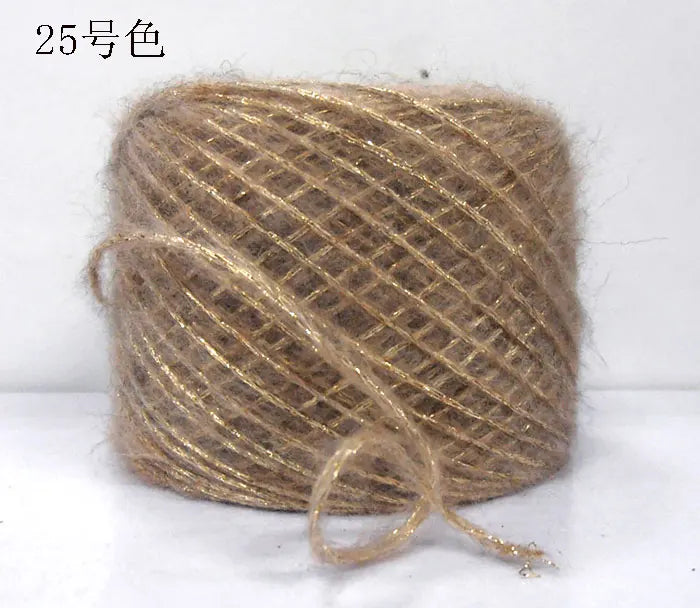 A ball of metallic gold merino wool yarn used for hand knitting.