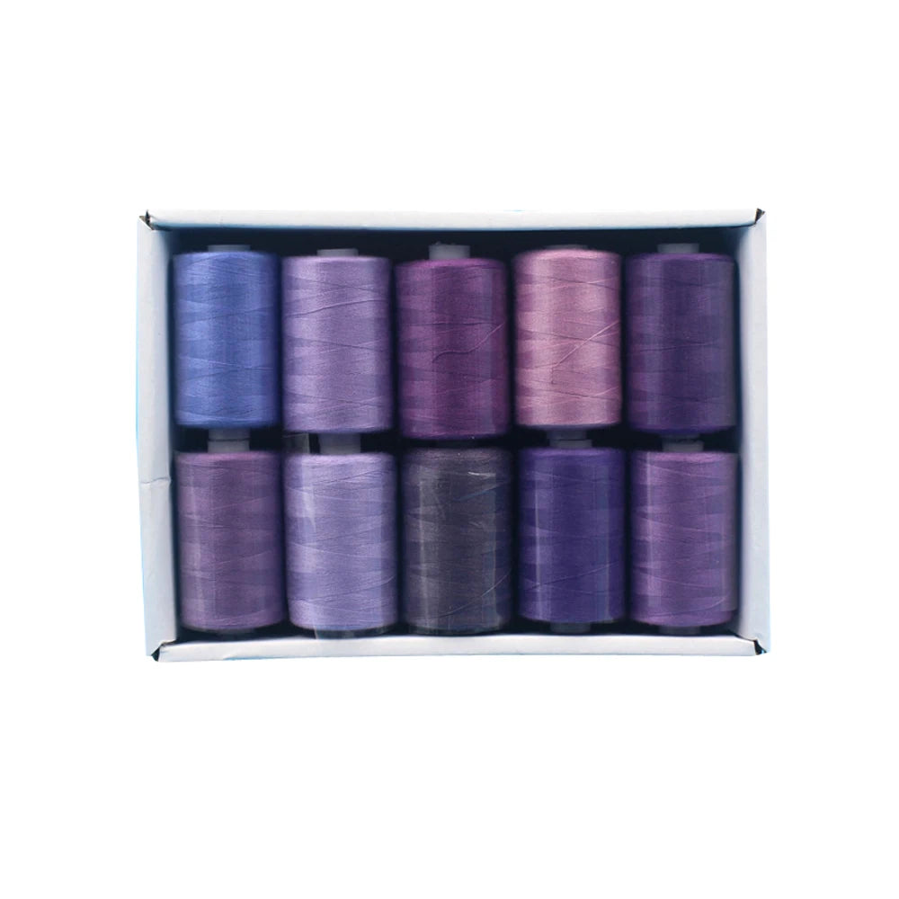 A box containing ten colorful polyester sewing thread spools in various shades of purple and gray.