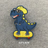 A blue dinosaur patch wearing a yellow crown and standing on a yellow skateboard