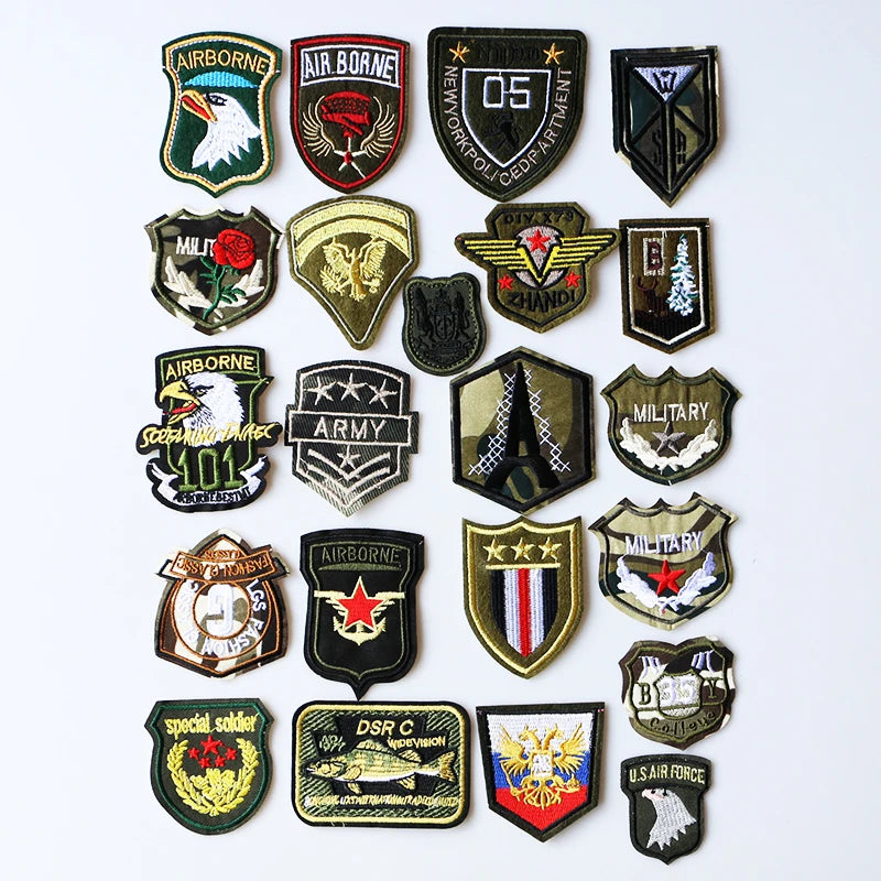 A collection of embroidered iron-on patches representing various US military and service organizations.