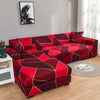 A deep red and maroon L-shaped sofa protector cover featuring a geometric pattern in a modern living room.