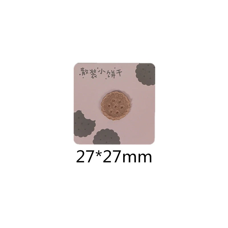 A square patch featuring a round, textured brown food or drink design on a light pink background.