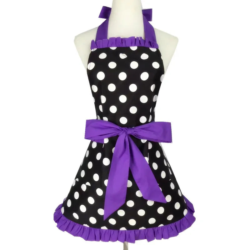 A purple polka dot ruffle apron with pockets displayed on a mannequin.