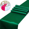 Emerald green satin table runner with rolled edges and a small inset showing a decorated dining table.