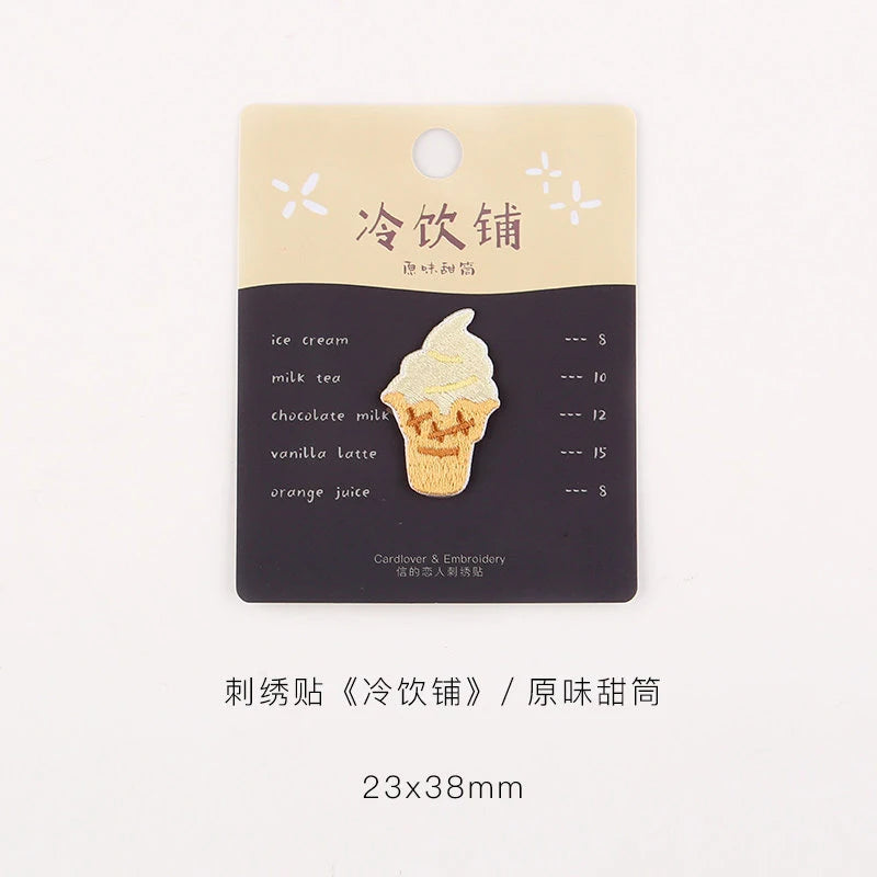 A rectangular beige patch with black text listing various iced drinks like ice cream, milk tea, and latte.