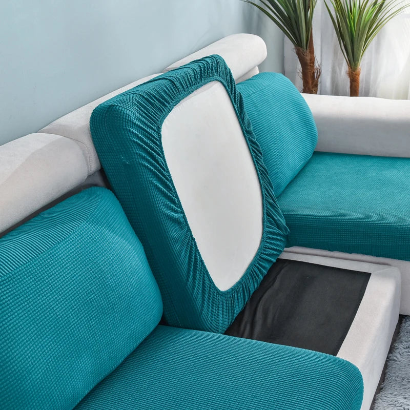 Teal stretch sofa seat cushion protector slipcover with a white back and black insert