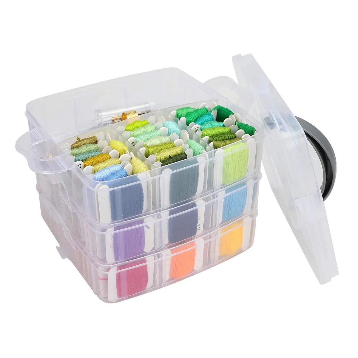 A clear plastic storage box containing various colored embroidery floss threads and a lid.