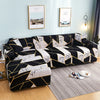 L-shape sofa protector covers featuring a black and white marble pattern on a light blue wall.