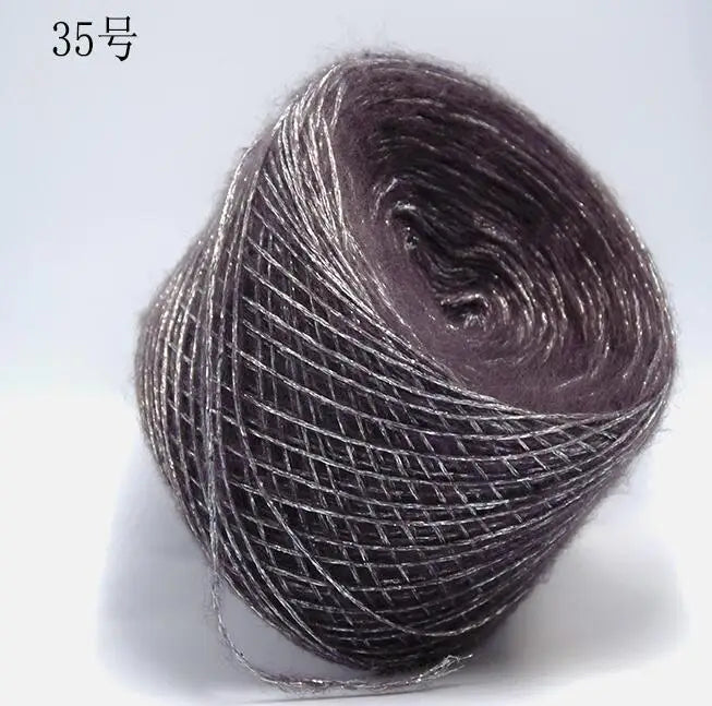 A ball of metallic gray merino wool yarn for hand knitting