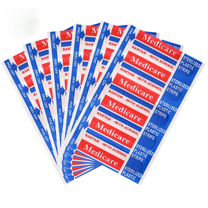 A fan of red and blue adhesive first aid plasters with Medicare branding and various sizes.