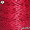 A spool of red embroidery thread with a white label visible on the side.