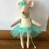 A handmade cotton toy filler batting shaped like a small brown rabbit with light tan ears and a turquoise tutu skirt.