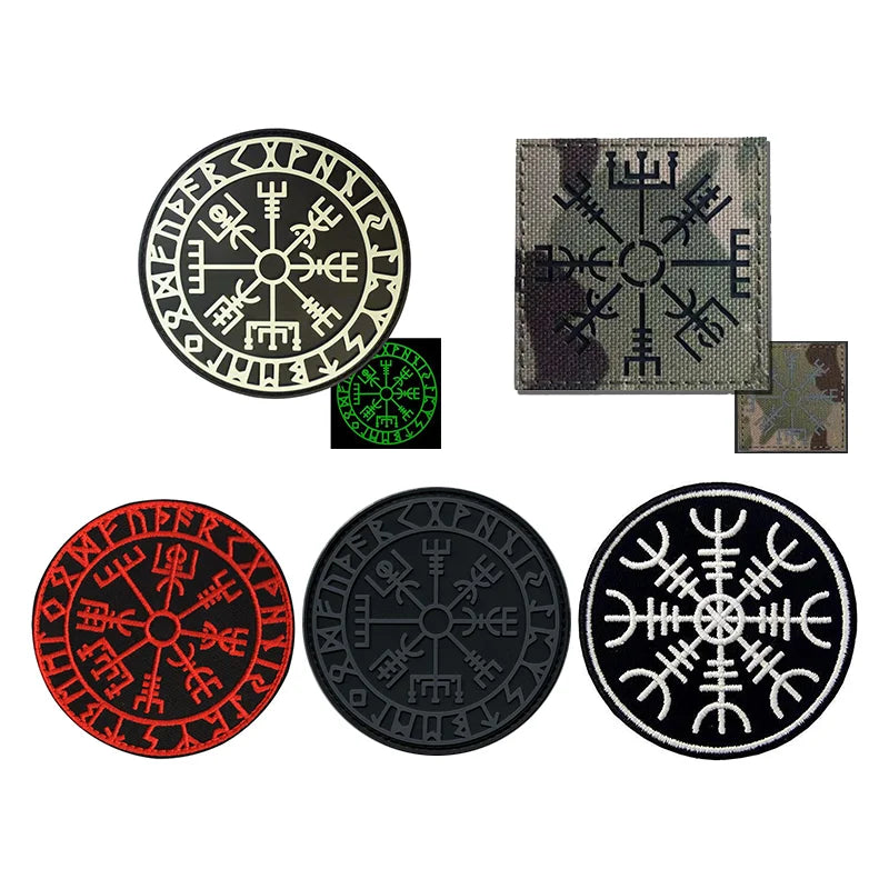 Four embroidered patches featuring Viking Valknut symbols in black, red, and green on fabric.