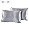 One silky satin pillowcase in a light silver color.
