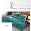 Teal crystal velvet quilted bedding featuring three needle and five thread reinforced hemming for durability