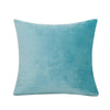 A solid teal velvet decorative cushion cover pillow.