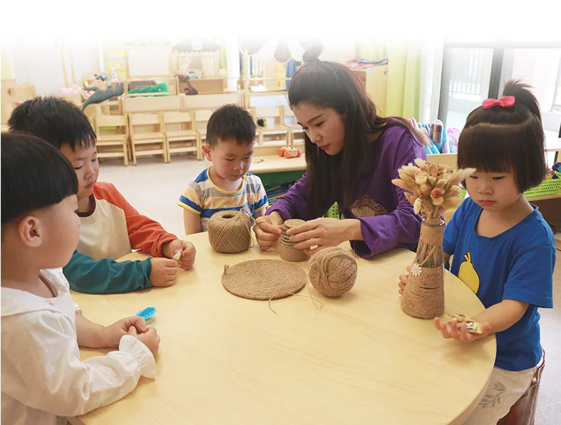 Children are engaged in a craft activity using natural hemp jute rope and other materials.